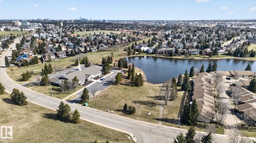 Aerial perspective showcasing a residential area with a prominent body of water - 46 903 109 Street, Edmonton, AB - Outdoor With Body Of Water With View