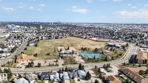Expansive land parcel with surrounding residential areas and a visible cityscape in the distance - 46 903 109 Street, Edmonton, AB - Outdoor With View