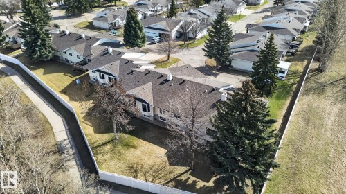 Expansive property featuring multiple residential units, a paved driveway, and mature landscaping - 46 903 109 Street, Edmonton, AB - Outdoor With View