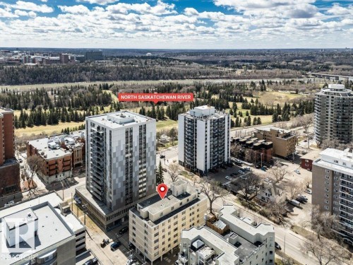 Aerial perspective of a multi-story residential building featuring a flat roof and a neutral-toned exterior - 403 10021 116 Street, Edmonton, AB - Outdoor With View