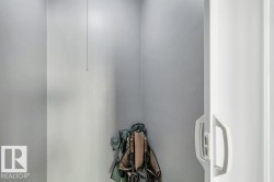 White wall paneling with a sliding door and minimalist handle - 