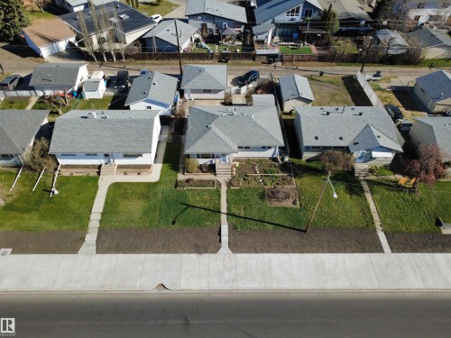 Single-story residence featuring a light gray shingle roof and white exterior siding - 16112 87 Avenue, Edmonton, AB - Outdoor With View