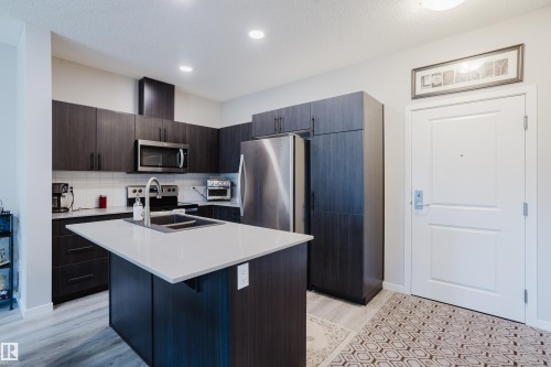 152 1818 Rutherford Road, Edmonton, AB - Indoor Photo Showing Kitchen With Stainless Steel Kitchen With Double Sink