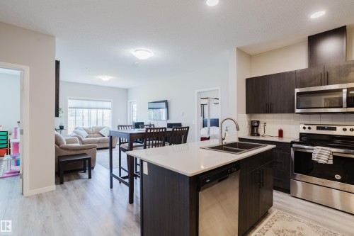 152 1818 Rutherford Road, Edmonton, AB - Indoor Photo Showing Kitchen With Stainless Steel Kitchen With Double Sink With Upgraded Kitchen