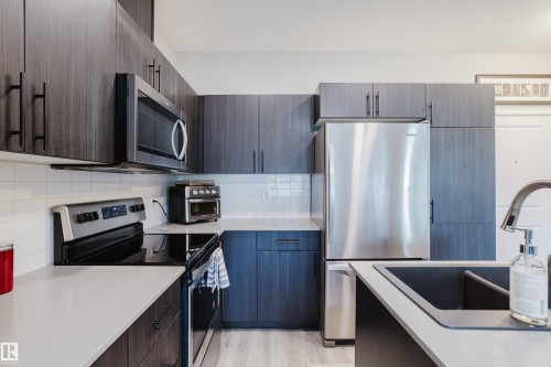 152 1818 Rutherford Road, Edmonton, AB - Indoor Photo Showing Kitchen With Stainless Steel Kitchen With Upgraded Kitchen