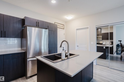152 1818 Rutherford Road, Edmonton, AB - Indoor Photo Showing Kitchen With Stainless Steel Kitchen With Double Sink With Upgraded Kitchen