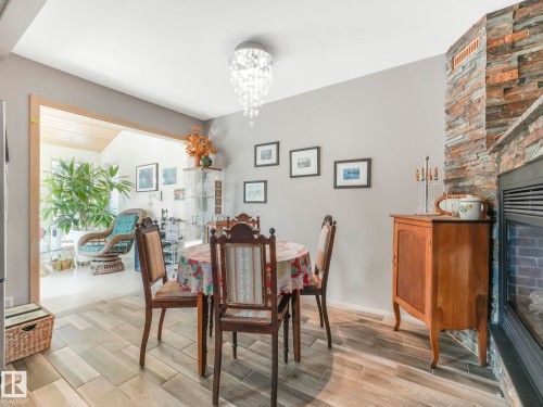 10961 75 Avenue, Edmonton, AB - Indoor Photo Showing Dining Room With Fireplace
