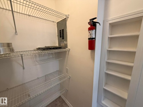 Wire shelving system providing vertical storage - 5 2204 118 Street, Edmonton, AB - Indoor With Storage