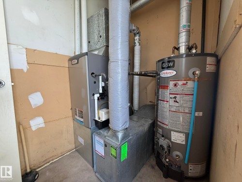 HERE IS YOUR UPGRADED H.E. FURNACE & HWT FOR MANY YEARS OF WARMTH... - 5 2204 118 Street, Edmonton, AB - Indoor Photo Showing Basement