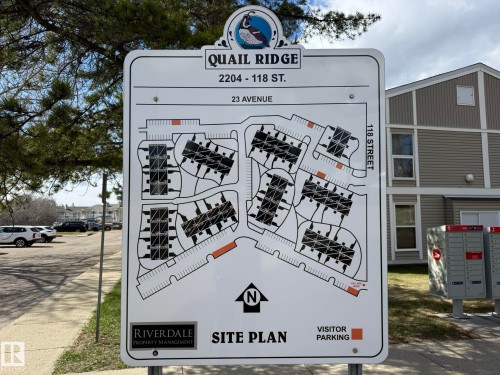 Site plan display board featuring a detailed layout of Quail Ridge community, including individual building configurations and street designations - 5 2204 118 Street, Edmonton, AB - Other