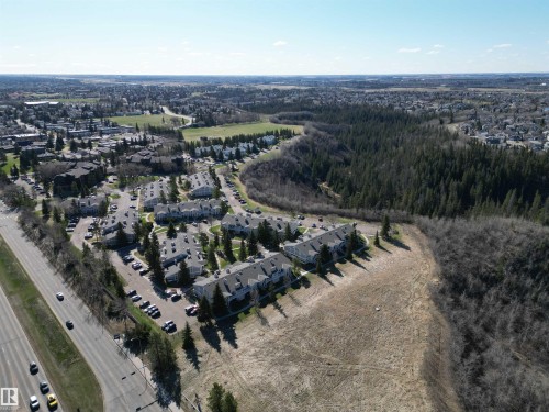 Residential complex with multiple buildings, bordering a wooded area and open terrain - 5 2204 118 Street, Edmonton, AB - Outdoor With View
