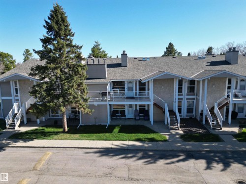 Multi-unit residential building featuring stucco and siding exteriors - 5 2204 118 Street, Edmonton, AB - Outdoor With Facade