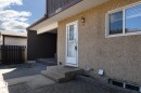 Stucco exterior with concrete steps leading to the main entry - 8039 27 Avenue, Edmonton, AB  - Outdoor With Deck Patio Veranda With Exterior 