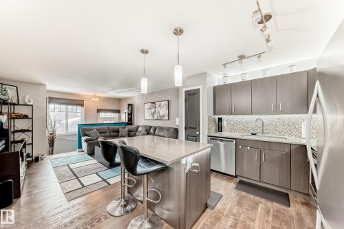 43 3305 Orchards Link, Edmonton, AB - Indoor Photo Showing Kitchen With Stainless Steel Kitchen With Upgraded Kitchen