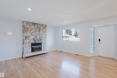7108 83 Street, Edmonton, AB - Indoor Photo Showing Living Room With Fireplace
