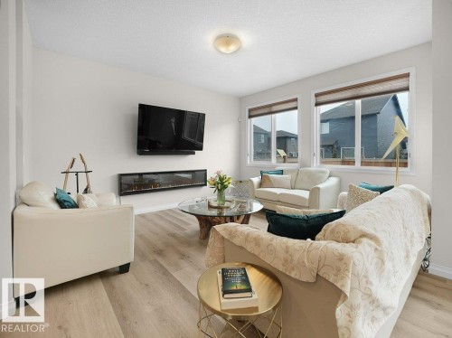 3114 Chokecherry Bend, Edmonton, AB - Indoor Photo Showing Living Room With Fireplace