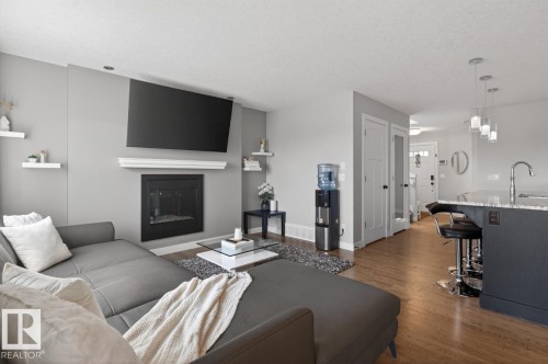 7135 Cardinal Way, Edmonton, AB - Indoor Photo Showing Living Room With Fireplace
