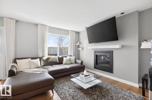 7135 Cardinal Way, Edmonton, AB - Indoor Photo Showing Living Room With Fireplace
