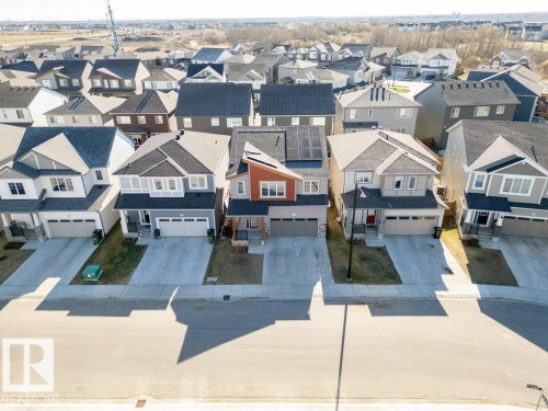 Contemporary two-story residence featuring a striking orange and gray facade - 2011 207 Street, Edmonton, AB - Outdoor With Facade