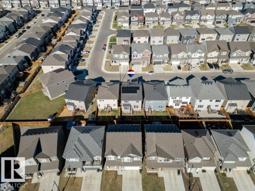 Aerial perspective showcasing a residential neighborhood with diverse housing styles, paved roadways, and private driveways - 2011 207 Street, Edmonton, AB -  With View
