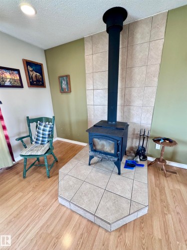 5121 52 Street, Andrew, AB - Indoor With Fireplace