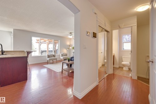 This property features rich hardwood flooring throughout the main living areas - 24 Birchmont Drive, Leduc, AB - Indoor Photo Showing Other Room