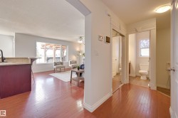 This property features rich hardwood flooring throughout the main living areas - 