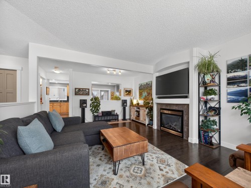 25 420 Hunters Green, Edmonton, AB - Indoor Photo Showing Living Room With Fireplace