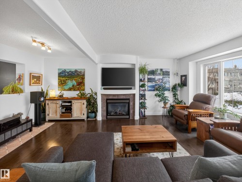 25 420 Hunters Green, Edmonton, AB - Indoor Photo Showing Living Room With Fireplace