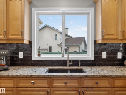 25 420 Hunters Green, Edmonton, AB - Indoor Photo Showing Kitchen With Double Sink