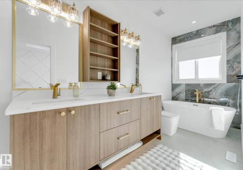 Double vanity with a white countertop and gold-finish fixtures - 4727 17 Avenue Sw, Edmonton, AB - Indoor Photo Showing Bathroom