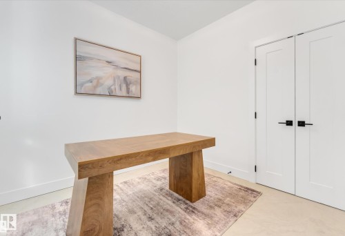 Bright room featuring light-toned flooring and white walls - 4727 17 Avenue Sw, Edmonton, AB - Indoor Photo Showing Other Room