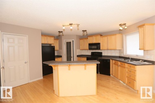10903 8 Avenue, Edmonton, AB - Indoor Photo Showing Kitchen With Double Sink