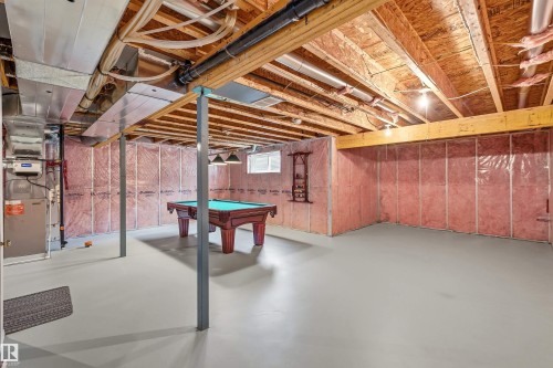 Unfinished basement with painted concrete flooring - 2340 Hagen Link, Edmonton, AB - Indoor Photo Showing Basement