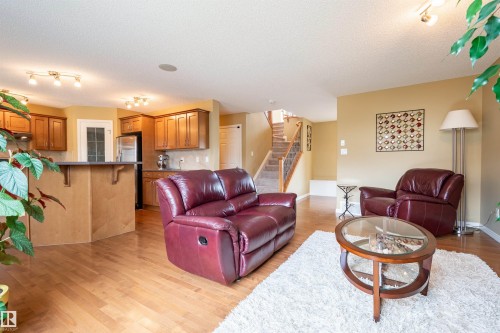 Open concept living area with wood-finish flooring - 2340 Hagen Link, Edmonton, AB - Indoor Photo Showing Living Room