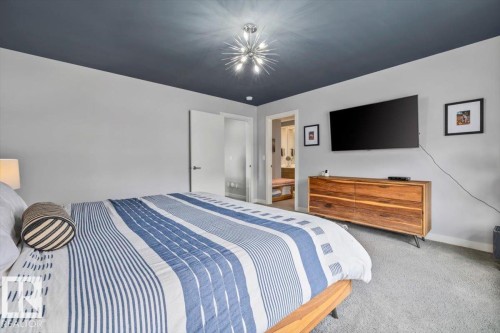 Bedroom featuring a dark-toned ceiling, light gray walls, and carpet flooring - 11245 64 Street, Edmonton, AB - Indoor Photo Showing Bedroom