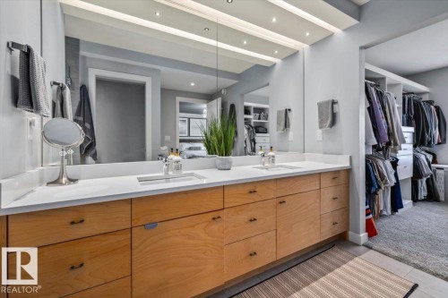 Dual vanity with light wood-finish cabinetry and white countertops - 11245 64 Street, Edmonton, AB - Indoor Photo Showing Bathroom