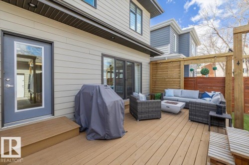 Outdoor spa framed by a wooden pergola, set on a concrete patio - 11245 64 Street, Edmonton, AB - Outdoor With Deck Patio Veranda
