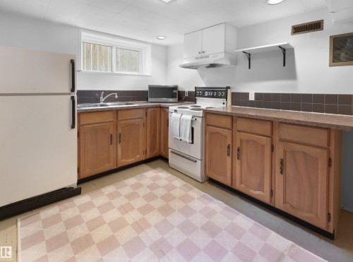 9808 90 Avenue, Edmonton, AB - Indoor Photo Showing Kitchen With Double Sink