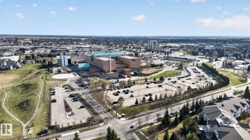 Aerial perspective showcasing a sprawling urban landscape with extensive commercial and residential development - 64 3311 58 Street, Edmonton, AB - Outdoor With View