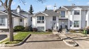 White vinyl siding exterior with an asphalt shingle roof - 64 3311 58 Street, Edmonton, AB  - Outdoor With Facade 
