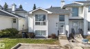 White vinyl siding exterior with an asphalt shingle roof - 64 3311 58 Street, Edmonton, AB  - Outdoor With Facade 