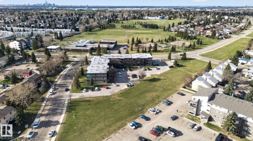 Aerial perspective showcasing an urban landscape with diverse residential structures - 64 3311 58 Street, Edmonton, AB - Outdoor With View