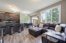 Open-concept living space with wood-finish flooring - 11 94 Longview Drive, Spruce Grove, AB  - Indoor 