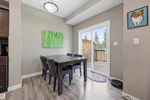 Dining area featuring wood-finish flooring and neutral wall tones - 11 94 Longview Drive, Spruce Grove, AB - Indoor Photo Showing Dining Room