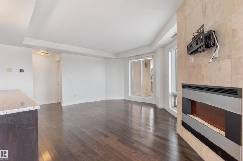 1901 10388 105 Street, Edmonton, AB - Indoor Photo Showing Other Room With Fireplace
