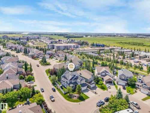 Aerial perspective of a residential neighborhood featuring detached properties with attached garages and mature landscaping - 932 Summerside Link, Edmonton, AB - Outdoor With View