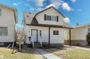White siding exterior with a brown shingled roof and coordinating brown trim - 10831 80 Avenue, Edmonton, AB  - Outdoor 