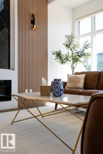 Accent wall featuring vertical wood paneling and a modern sconce - 5627 Kootook Place, Edmonton, AB - Indoor