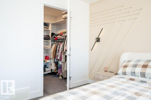 Walk-in closet featuring built-in shelving and hanging rods - 5627 Kootook Place, Edmonton, AB - Indoor Photo Showing Bedroom